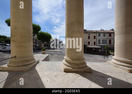 Street Scene & Town Square Looking Through Neoclassical Columns of Saint Martin Church, aka Collégiale Saint-Martin, Saint-Remy-de-Provence France Stock Photo