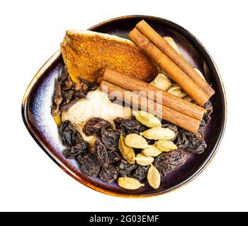 top view of dried Mulling spices in ceramic bowl isolated on white background Stock Photo