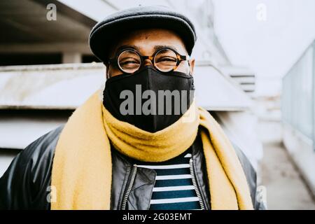 Senior man wearing protective face mask during COVID-19 Stock Photo
