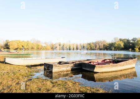 Moored wooden fishing boats, for the bank of the tributary, the river Danube. Stock Photo