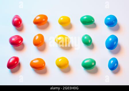 Multi-colored candy in multi-colored light Stock Photo