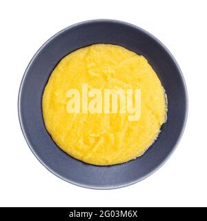 top view of cooked maize porridge in gray bowl isolated on white background Stock Photo