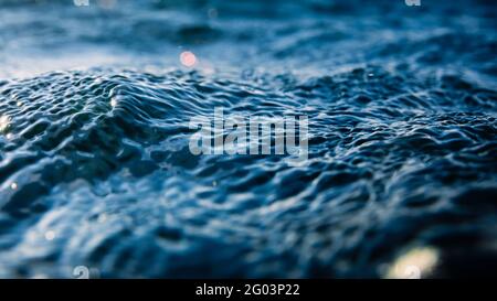 Water texture with sea waves, bokeh and drops. Liquid background Stock Photo
