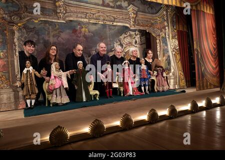 Puppeteers and actors of the Carlo Colla Company, behind the curtain at the end of the show at the Gerolamo historical theater, in Milan. Stock Photo