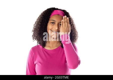Cute African teenager wearing a pink headband isolated on a white background Stock Photo