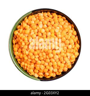 top view of raw whole red lentils in round bowl isolated on white background Stock Photo