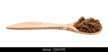 dark muscovado cane sugar in wooden spoon isolated on white background Stock Photo