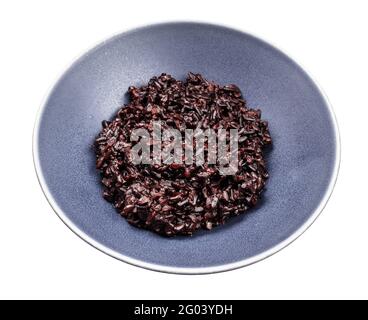boiled black rice in gray bowl isolated on white background Stock Photo
