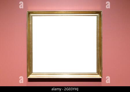 classical golden picture frame with cutout canvas on pink wall Stock Photo