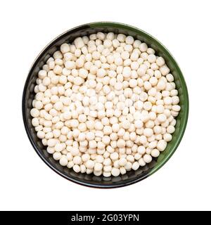 top view of israeli pearl couscous in round bowl isolated on white background Stock Photo
