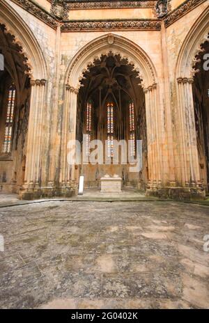 Old medieval chapels. imperfect chapels Batalha Monastery in Portugal Stock Photo
