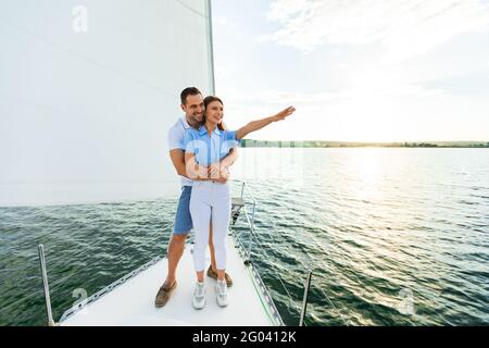 Loving Spouses Sailing Embracing Standing On Yacht Deck Stock Photo