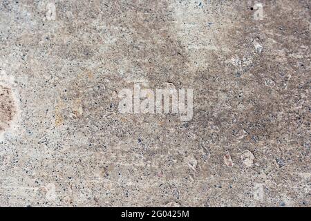 Wall of stone and marble blocks of gray and white colors, different textures. Texture of an old concrete wall Stock Photo