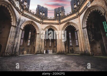 Old medieval chapels. imperfect chapels Batalha Monastery in Portugal Stock Photo