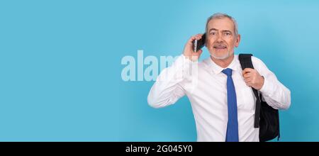 businessman with mobile phone and backpack isolated on background Stock Photo