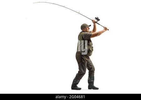 A Fisherman Sits On A Chair Against The Backdrop Of Fishing Rods