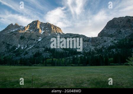 Carson Peak towers over the June Lake Loop in Mono County, CA, USA, even above Horsetail Waterfall. Stock Photo