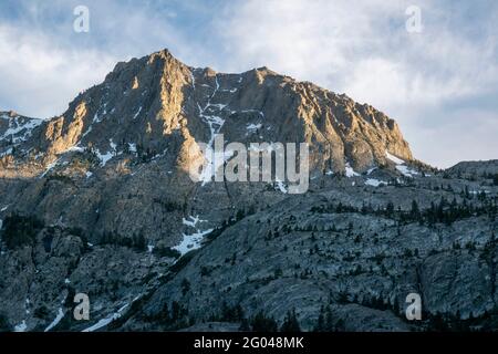 Carson Peak towers over the June Lake Loop in Mono County, CA, USA, even above Horsetail Waterfall. Stock Photo