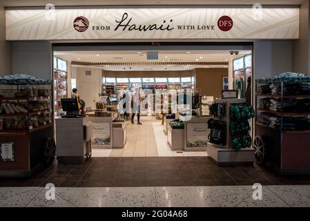 Honolulu, Hawaii.  Daniel K. Inouye International Airport. Travelers shopping in a duty free store in the airport concourse. Stock Photo