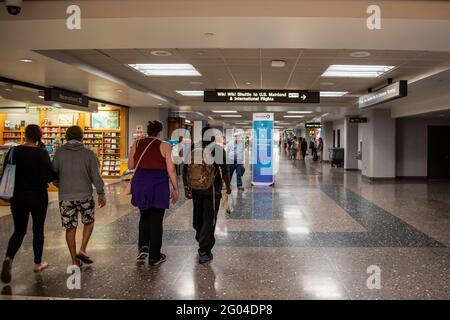 Honolulu, Hawaii.  Daniel K. Inouye International Airport. Travelers walking through the airport concourse. Stock Photo