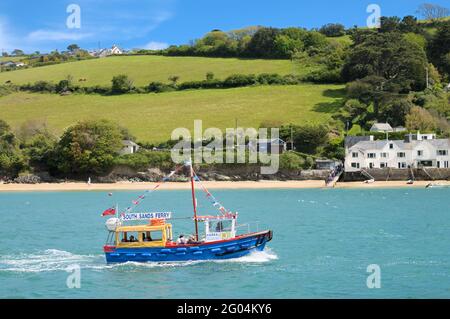 Tourists on the South Sands ferry boat on the Kingsbridge Estuary with East Portlemouth beach in the background, Salcombe, Devon, England, UK Stock Photo