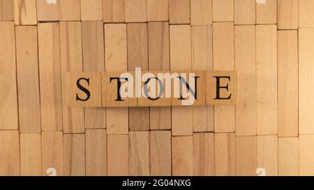The word stone created from wooden cubes. Stock Photo