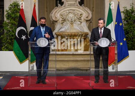 Rome, Italy. 31st May 2021. (210531) -- ROME, May 31, 2021 (Xinhua) -- Italian Prime Minister Mario Draghi (R) and Libyan Prime Minister Abdul Hamid Dbeibah attend a joint press conference in Rome, Italy, on May 31, 2021. Italy and Libya will work together on illegal immigration and renewable energies, Draghi and Dbeibah told reporters at the joint press conference after meeting here on Monday. (Pool via Xinhua) Credit: Xinhua/Alamy Live News Stock Photo