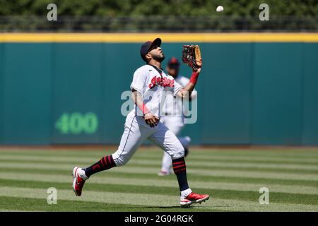 CLEVELAND, OH - May 30: Eddie Rosario (9) of the Cleveland Indians catches a fly ball on the run in left field during game one of a doubleheader again Stock Photo