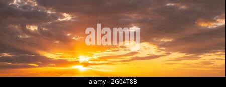 Sunshine In Sunrise Bright Dramatic Sky. Sun Ray Through Dark Rainy Clouds. Scenic Colorful Sky At Dawn. Sunset Sky Natural Abstract Background Stock Photo
