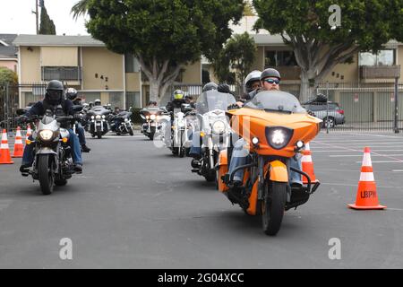 Long Beach, California, USA. 26th May, 2021. Participants on motorcycles arrive at the First Annual 'Run for the Rite' festival and concert event to benefit veterans on Memorial Day weekend at the Long Beach Scottish Rite Cultural Centre in Long Beach, California.  Credit: Sheri Determan Stock Photo