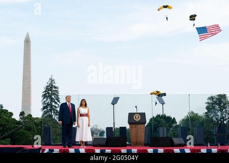 Members of the United States Army Golden Knights parachute toward the Ellipse as President Donald J. Trump and First Lady Melania Trump participate in the 2020 Salute to America event Saturday, July 4, 2020, on the South Lawn of the White House Stock Photo
