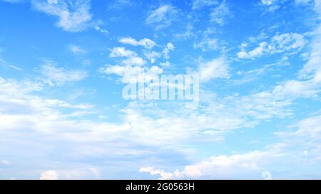 Blurred white clouds on the sky background. Stock Photo