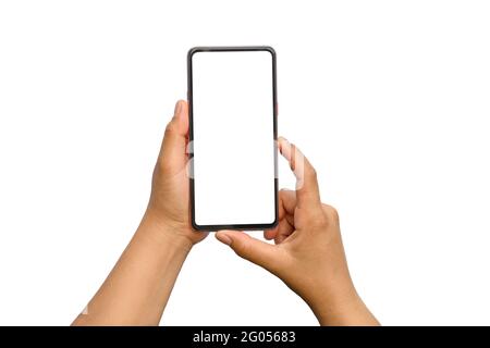 Close-up of two hands holding mobile phones, white screen separated on white background with clipping path. Stock Photo