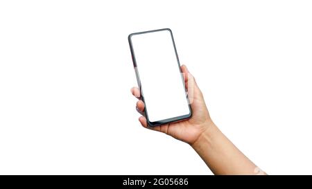 Close up of young woman hand holding a mobile phone, white screen separated on white background with clipping path. Stock Photo