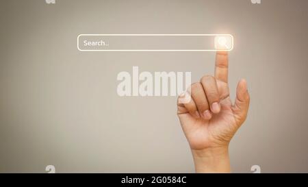 Business people click on the search bar to search for information surfing internet business concept. Stock Photo
