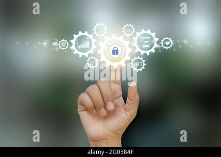 Business people clicking on protection icon internet business and financial security concept. Stock Photo
