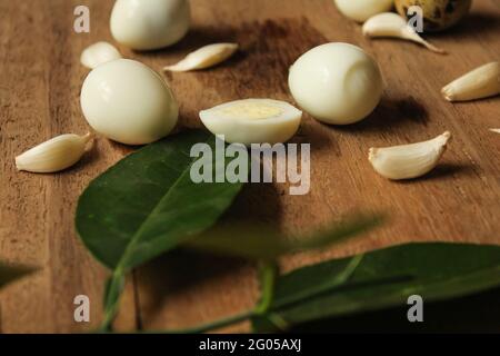Quail eggs,boiled quail eggs on wooden surface, food concept, new quail eggs stock image as you need. Stock Photo