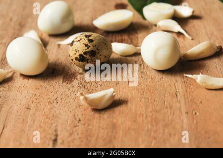 Boiled quail eggs on wooden surface,food concept, top view Stock Photo