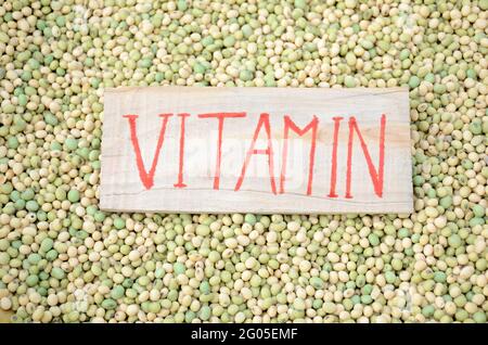 bunch the yellow green soybean grains with writing vitamin healthcare medical concept. Stock Photo