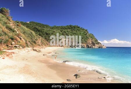 Visitors relax and play on the Anse des Grands Galets (Big Shell Beach) ca. 1998 Stock Photo