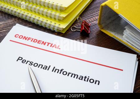 Personal information documents with label confidential on top. Stock Photo