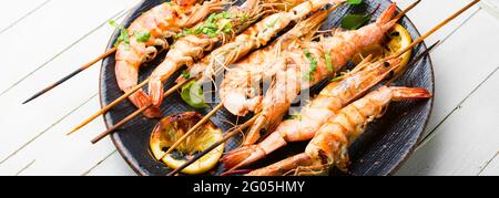 Langoustines or prawns on a skewer Stock Photo