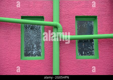 A new paint job on an old wall creates a colourful  textured background Stock Photo