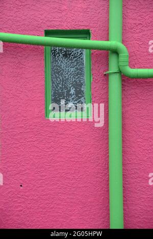 A new paint job on an old wall creates a colourful  textured background Stock Photo