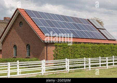 solar roof on an inhabited barn Stock Photo