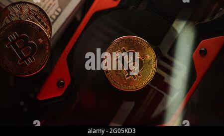 GPU mining digital cryptocurrency, Bitcoin (BTC) on the graphic card. Digital currencies industry, and GPU farming concept Stock Photo