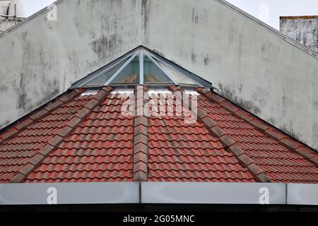 a tiled roof  on an historic building creates a rustic textured background Stock Photo