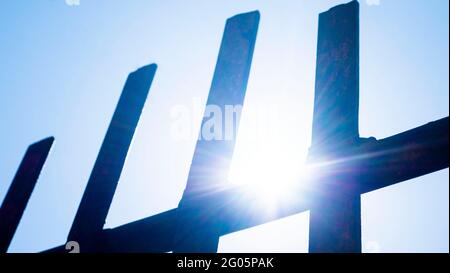 iron gates against the blue sky. an iron door. grid Stock Photo