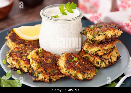 Zucchini Fritters With Sour Cream Stock Photo
