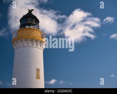 Designed by brothers David and Thomas Stevenson, Bressay Lighthouse on a sunny day, agains a blue sky with white clouds. Stock Photo